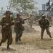 World War II re-enactors make their way down the battlefield and advance on the German troops during Thunder Over Michigan at Willow Run Airport Aug. 4.
Jeffrey Smith | AnnArbor.com